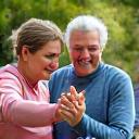 People celebrating achieving a fitness goal together, symbolizing goal-based community support.